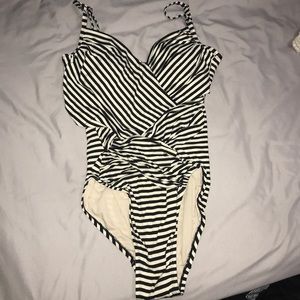 One piece flattering swim suit with low back